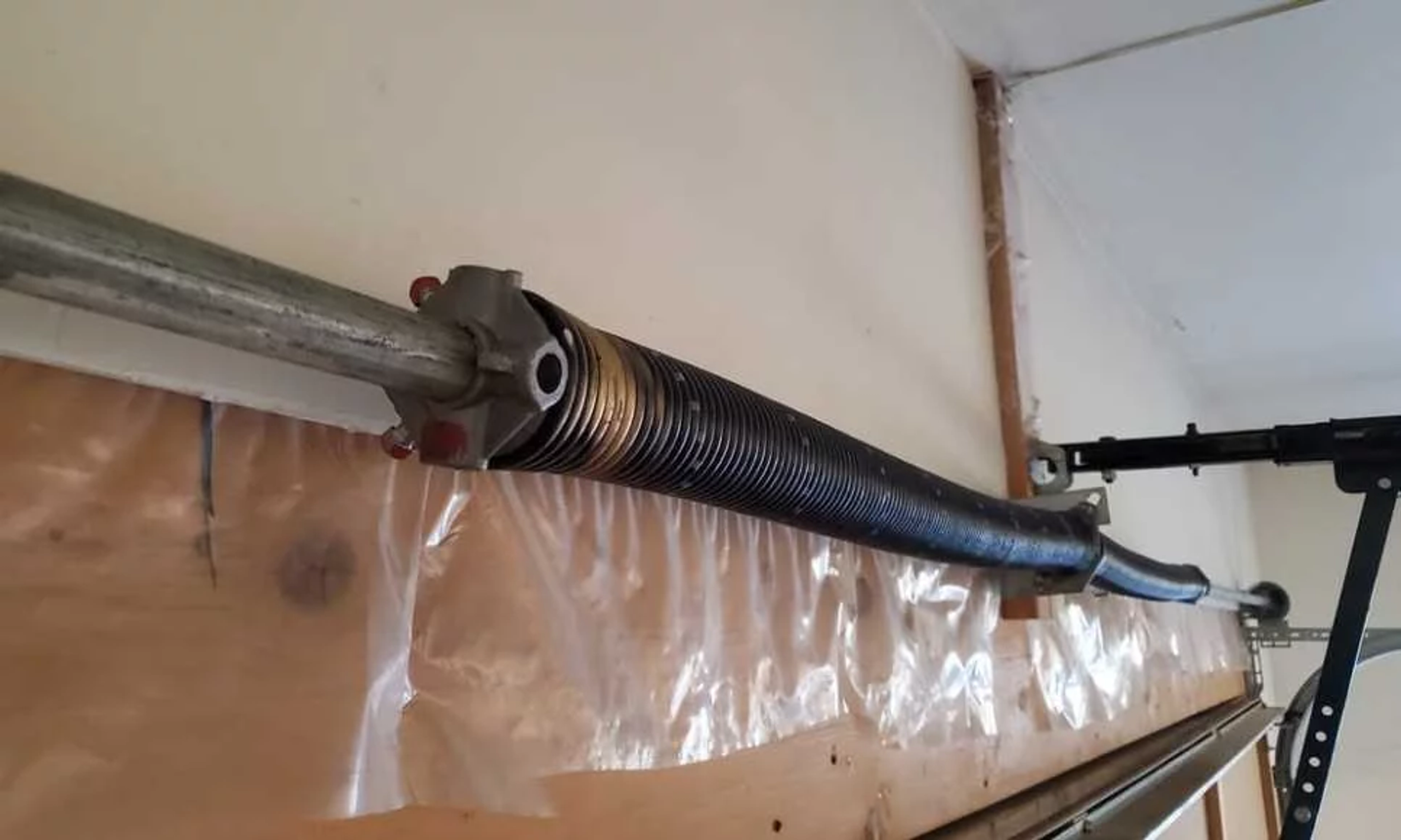 Comment tendre le ressort d’une porte de garage basculante ?