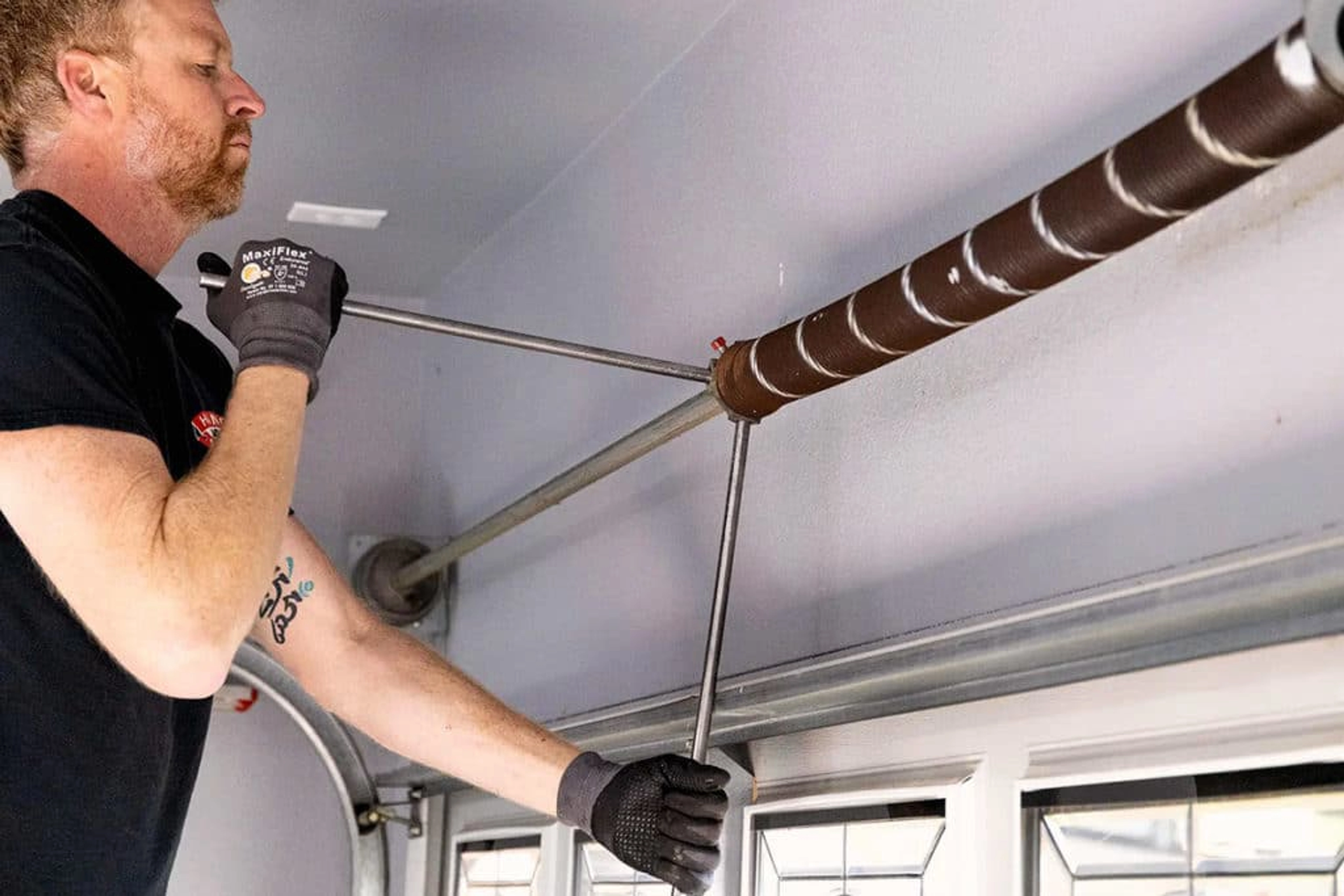 Comment tendre le ressort d’une porte de garage basculante ?